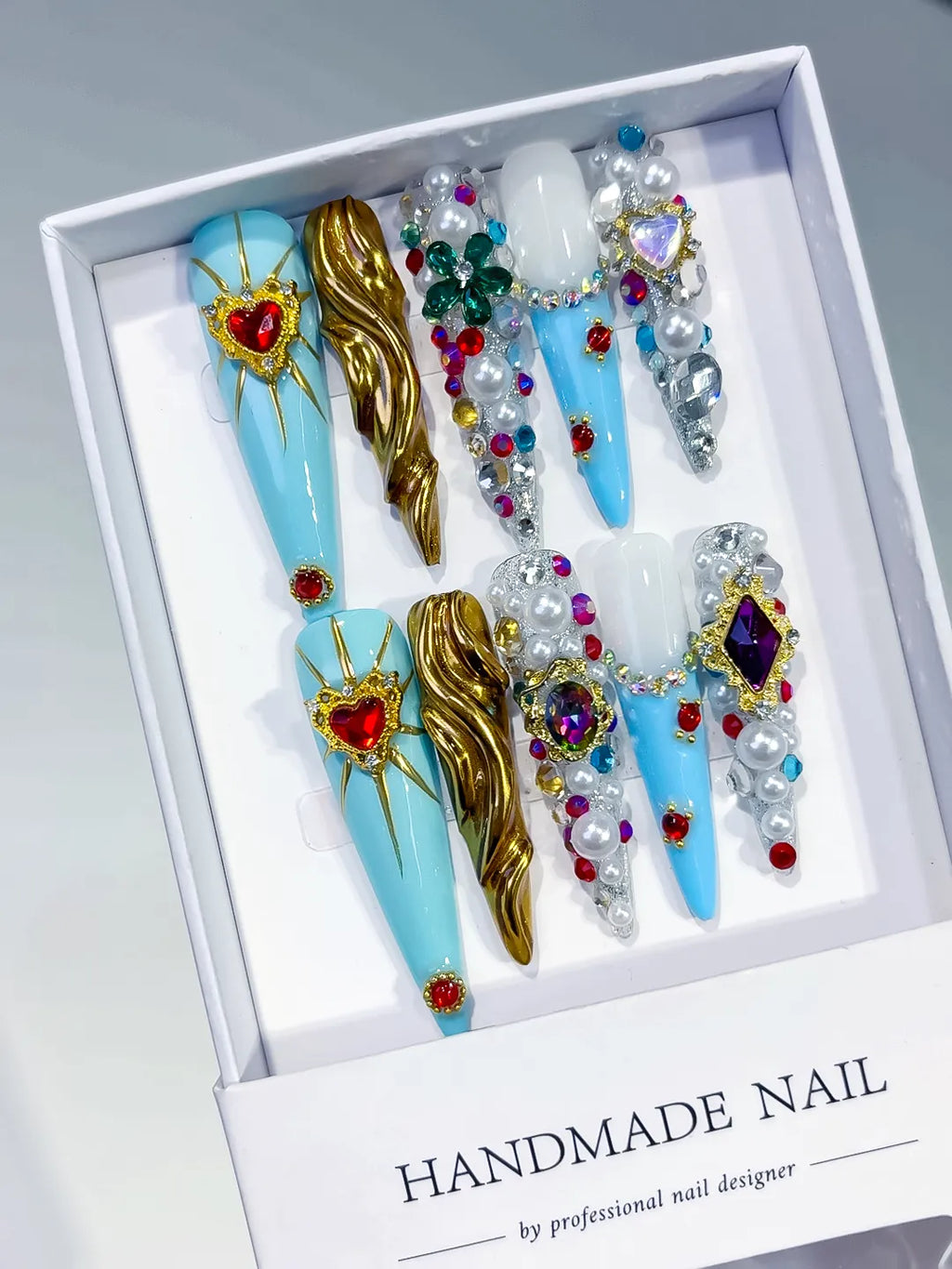 Blue White Gold Silver Red Green Purple Abstract Heart Pearl Rhinestone Metallic Accent 3D press on nails angled view