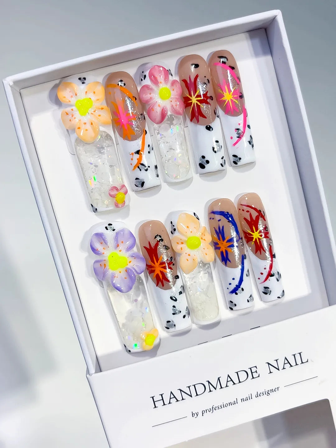 White Nude Orange Pink Red Blue Black Silver Abstract Flower Glitter Confetti Starburst 3D press on nails angled view