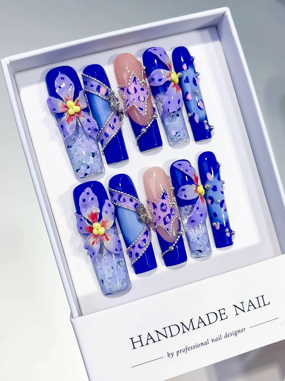 Blue Nude Purple Silver Abstract Flower Glitter Bow Rhinestone 3D press on nails angled view
