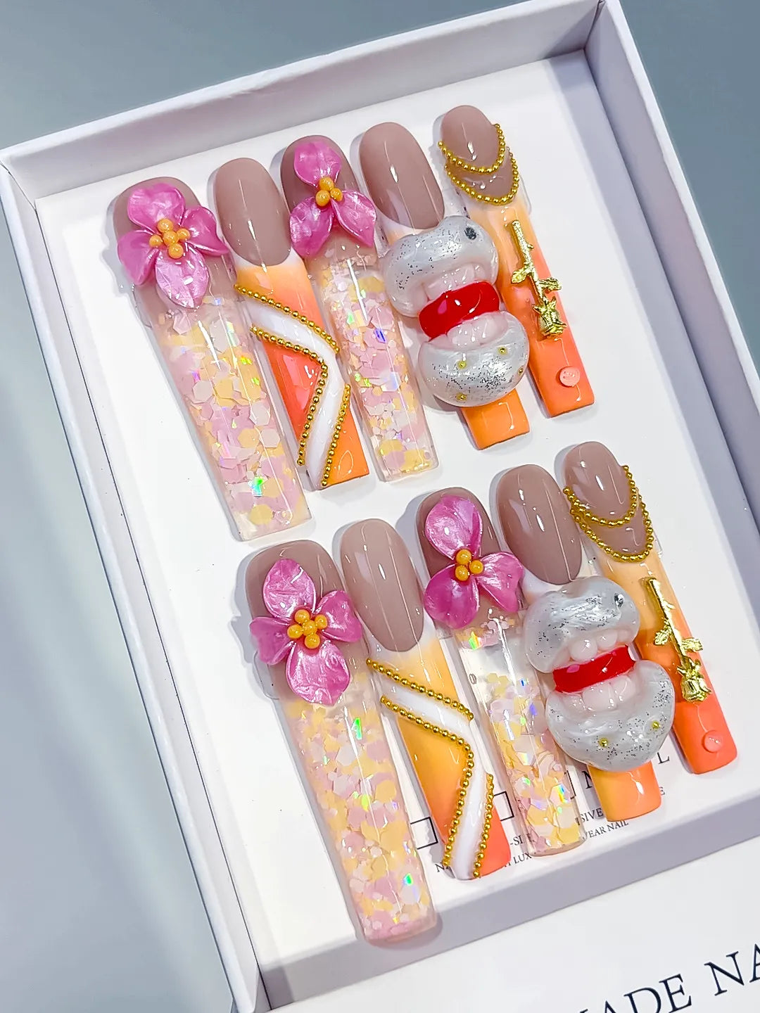 Nude Orange White Pink Gold Silver Multicolor Abstract Flower Lips Chain Glitter Metallic Accent 3D press on nails angled view