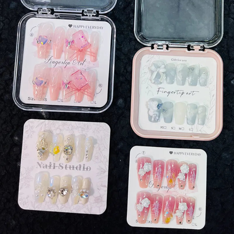 Wholesale handmade press-on nails packaged in boxes with custom branded backing cards.

