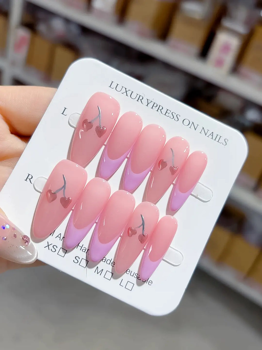 angled view of lavender-tip french with silver-stem heart cherries, handmade press on nails