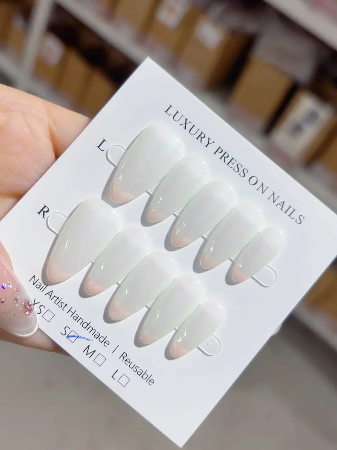 elegant medium almond white french handmade press on nails with iridescent green effect, full set display
