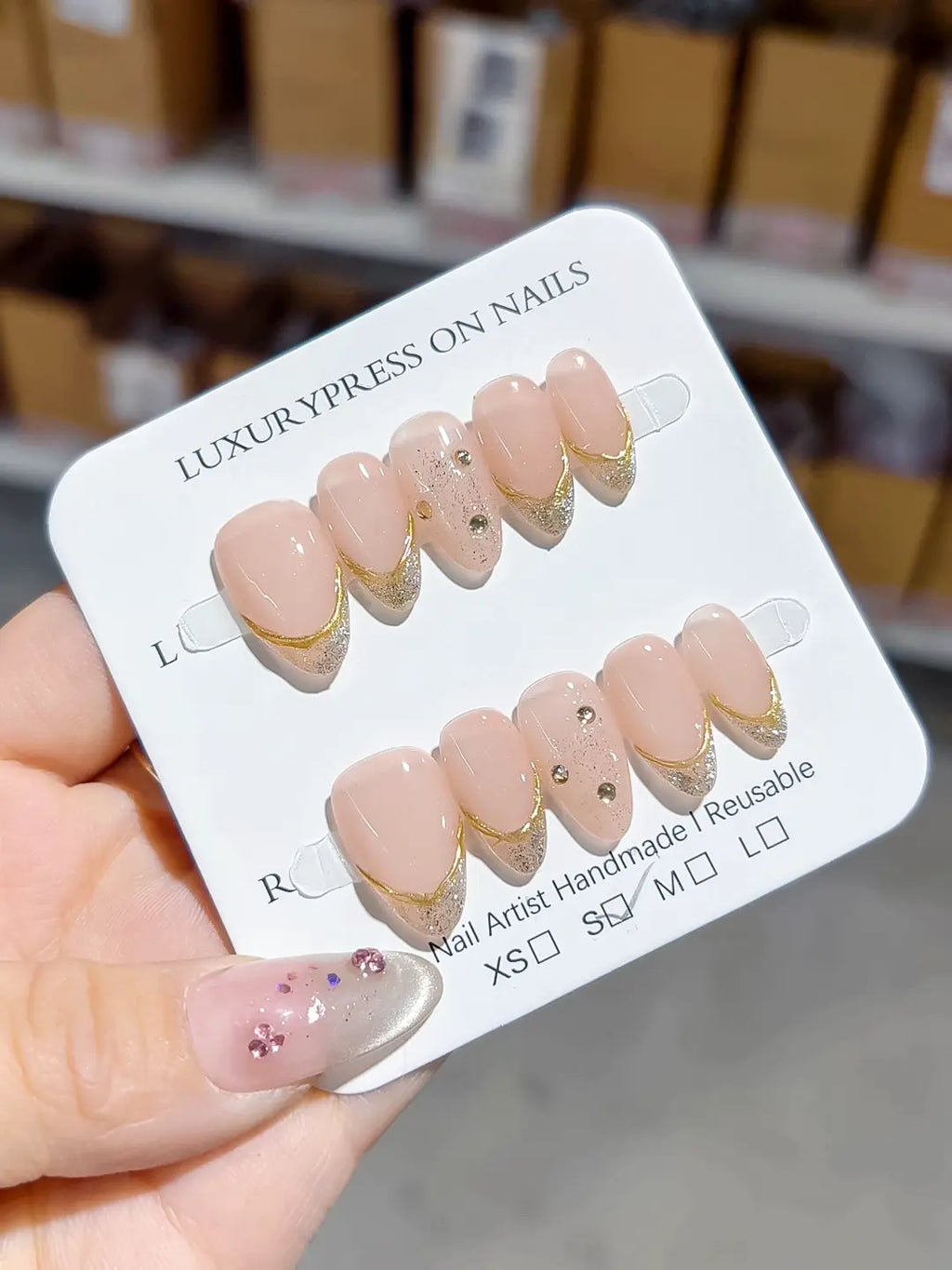 full set closeup, nude gold french with 3D rhinestone accents, handmade press on nails