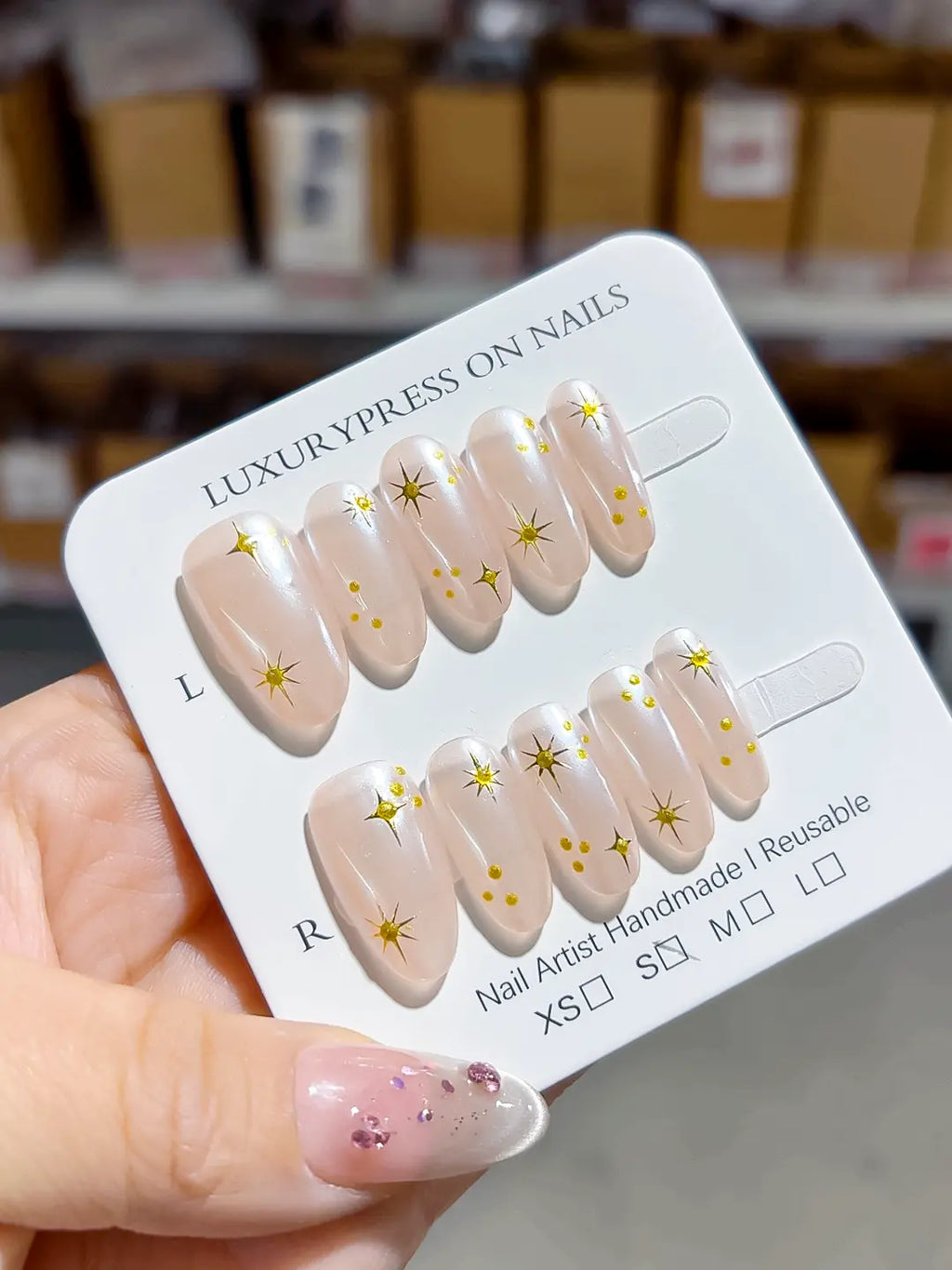 handmade press on nails, full set layout showing medium oval shape and glossy nude with gold details