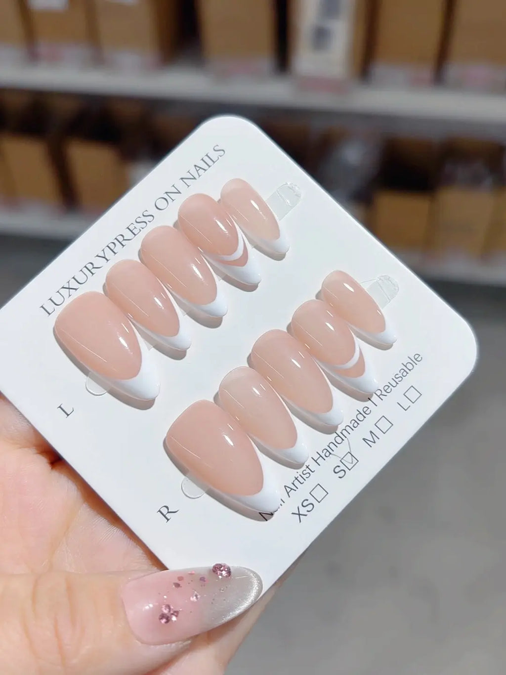 handmade press on nails in nude french design with double line accent, close-up view