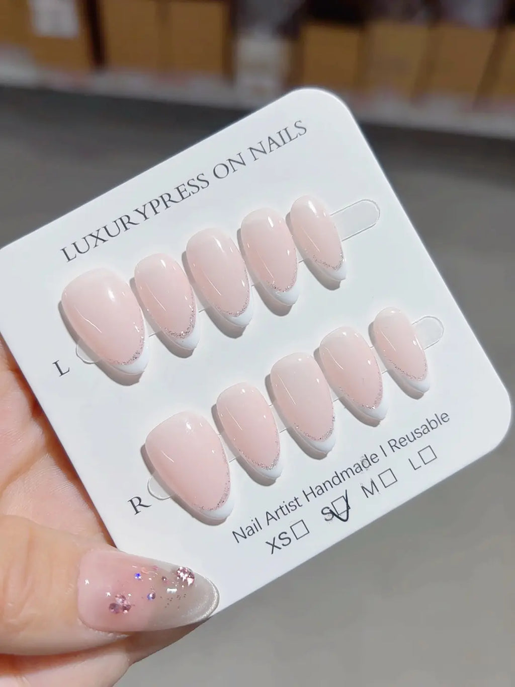 handmade press on nails short almond pink french tips, angled perspective