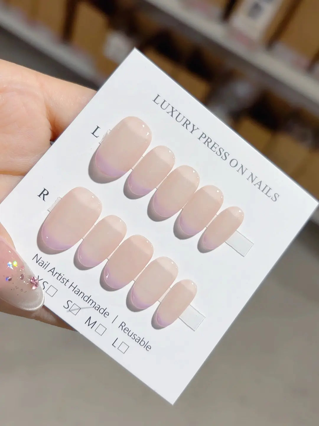 handmade press on nails short oval angled view showing purple French tip detail