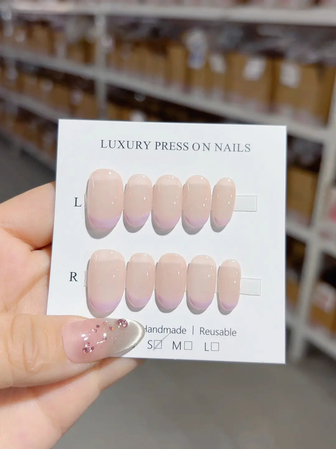 handmade press on nails short oval collection close-up with soft nude and purple tips
