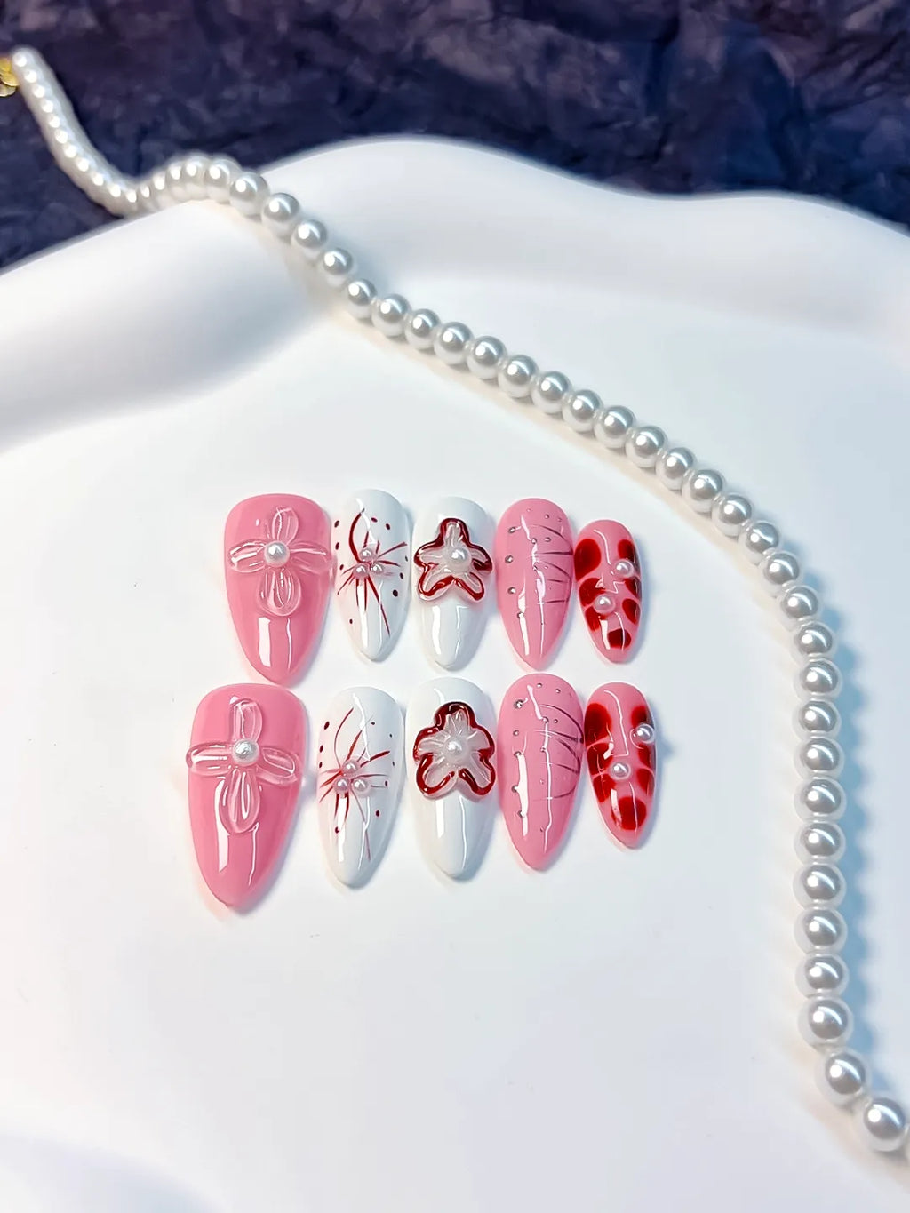 Pink White Red Abstract Bow Flower Pearl press on nails detail view