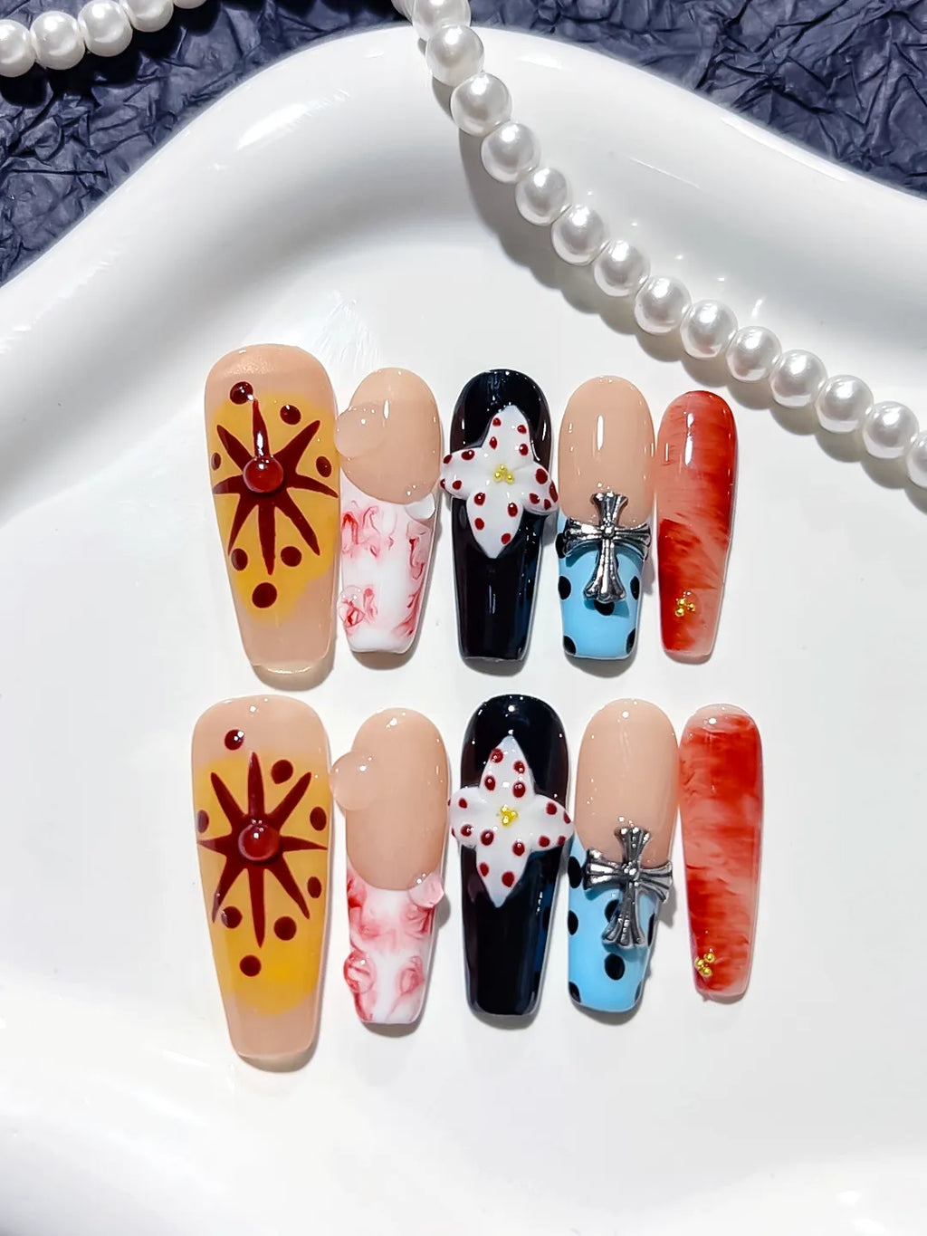 Nude Black Blue Orange Abstract Flower Cross press on nails close up