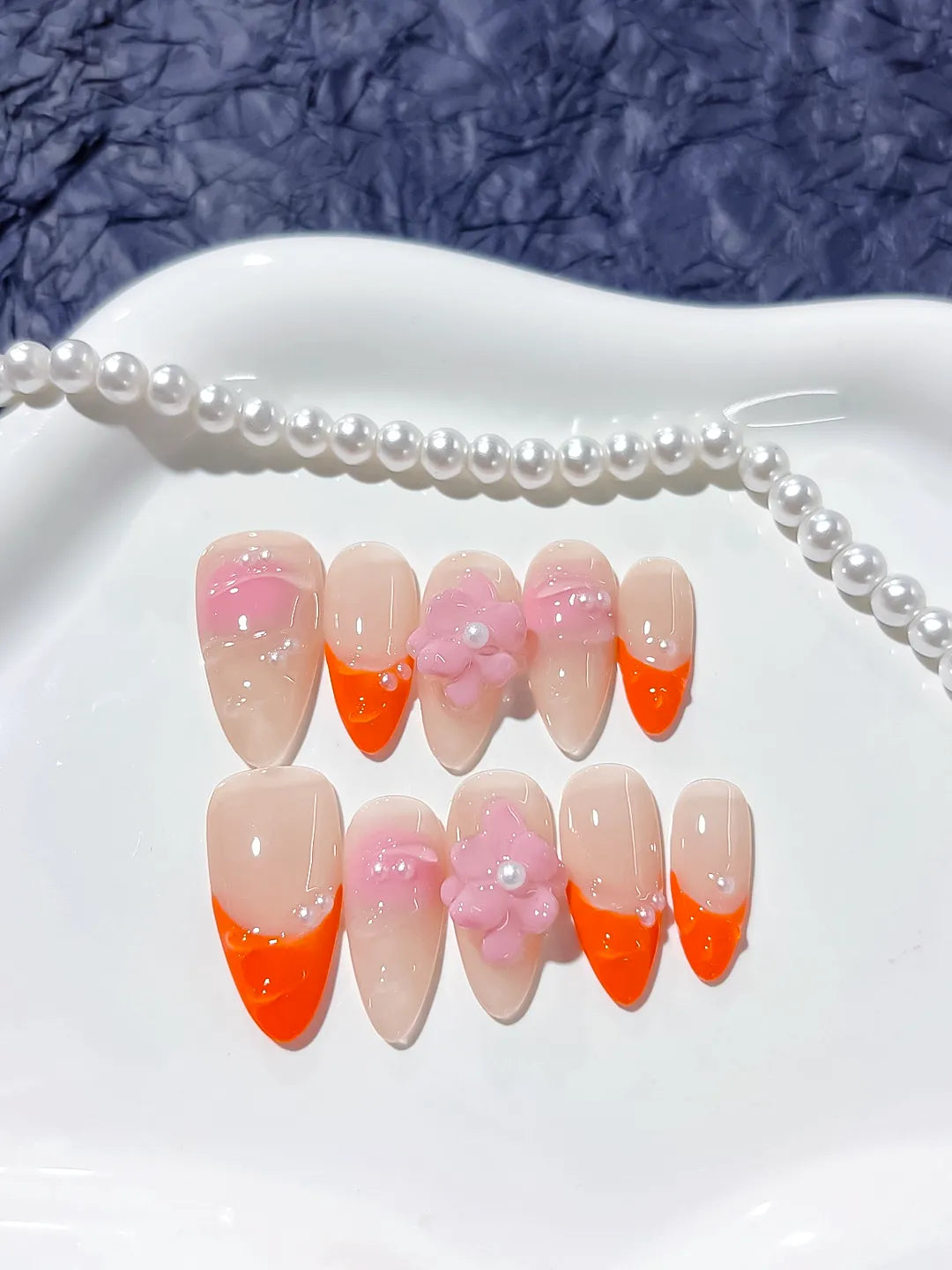 Nude Orange Pink French tip Flower Pearl press on nails close up
