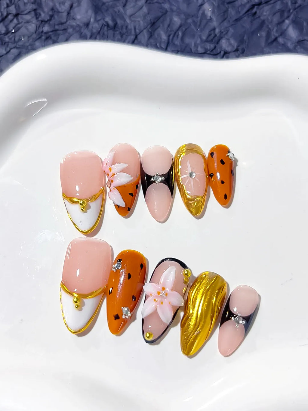 Nude Orange Gold Black Abstract Flower Metallic press on nails close up