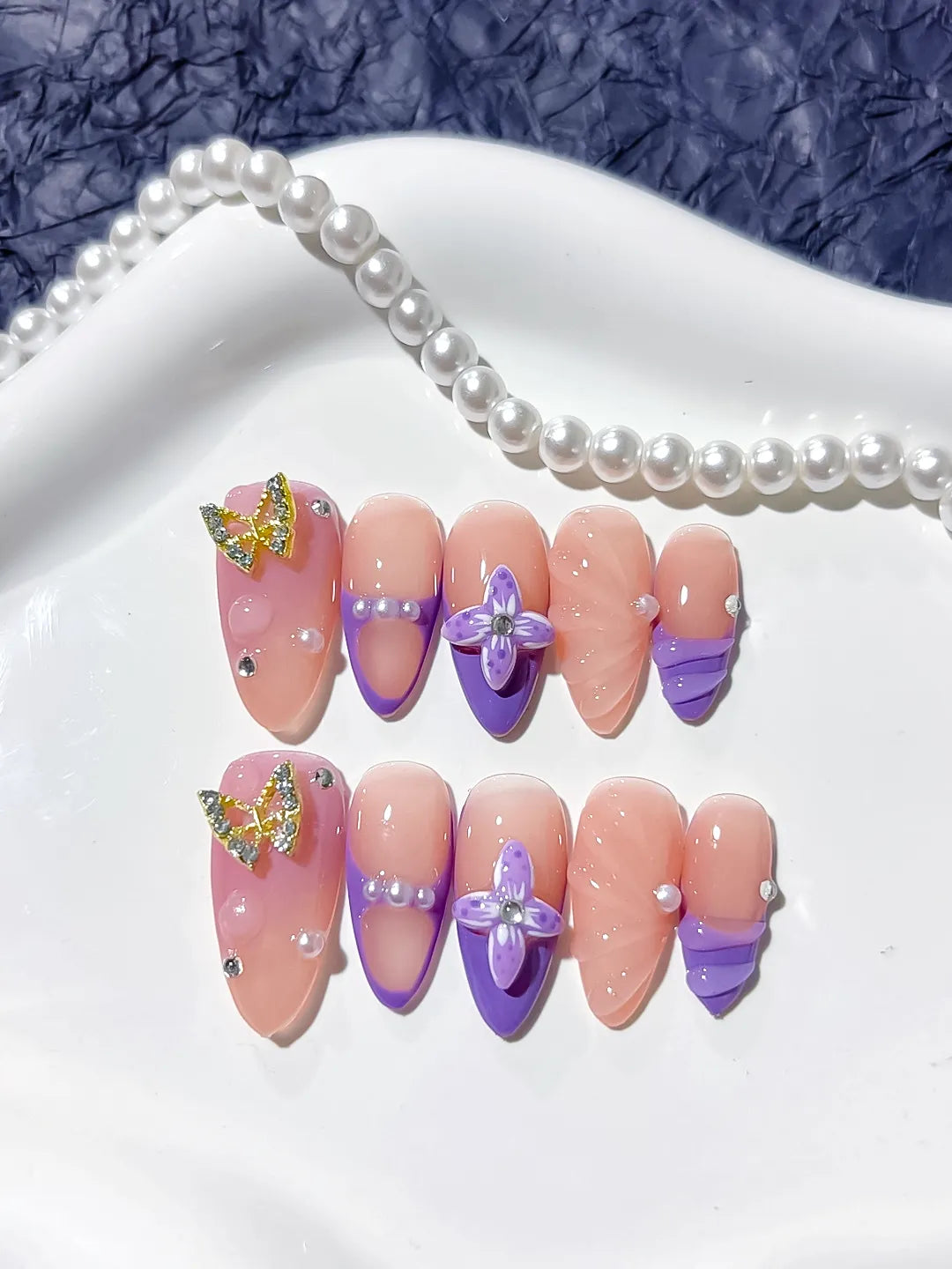 Nude Purple Gold French tip Butterfly Rhinestone press on nails close up