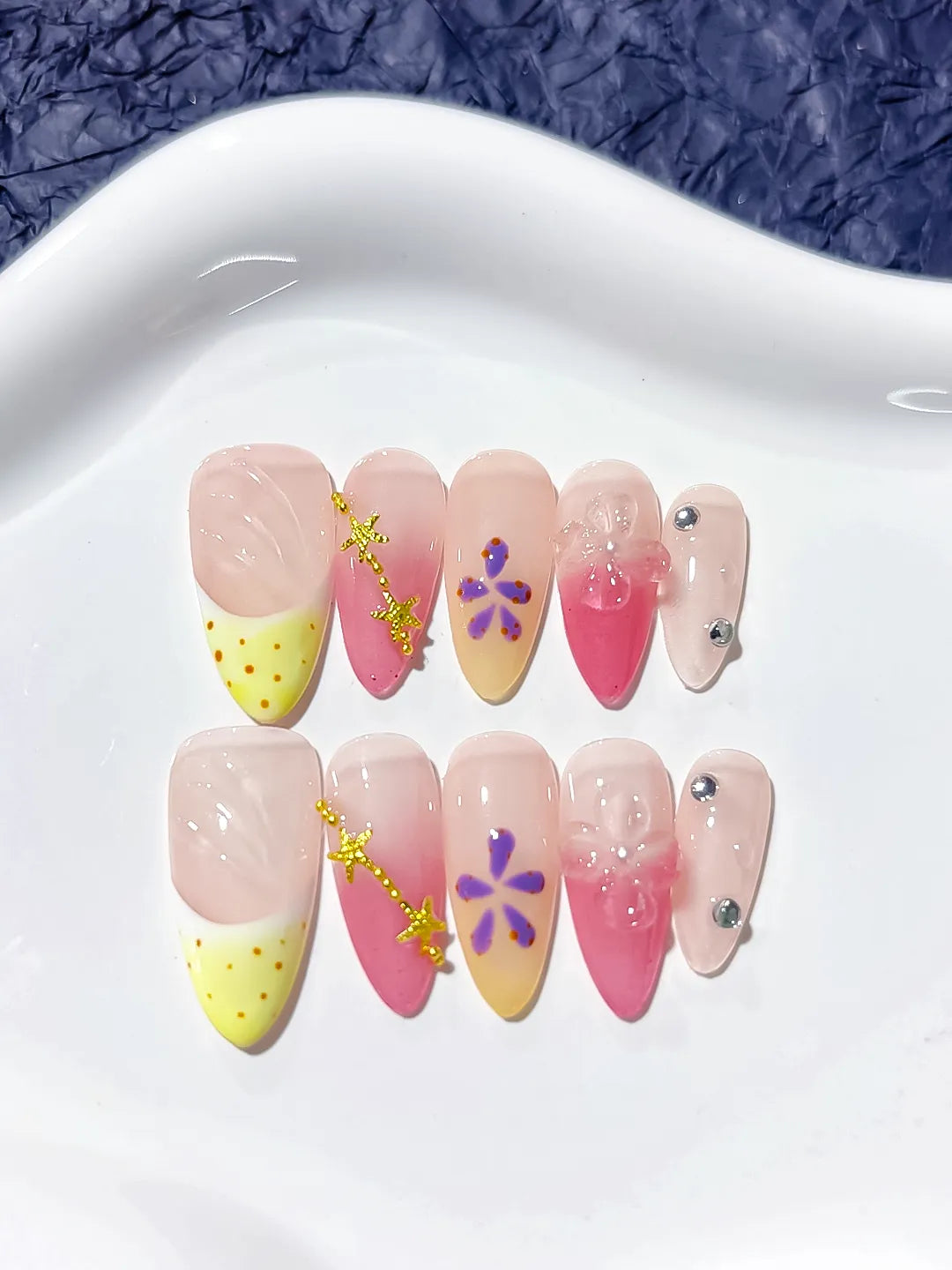 Nude Yellow Pink French tip Flower Star press on nails angled view