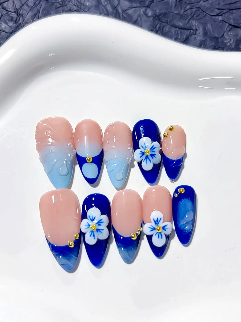 Nude Blue French tip Flower Metallic press on nails close up