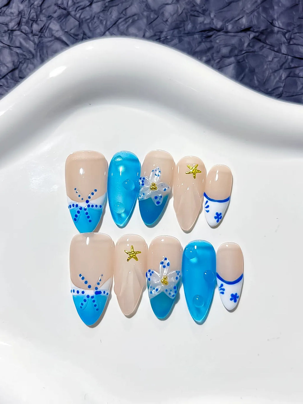 Nude Blue French tip Flower Star press on nails detail view