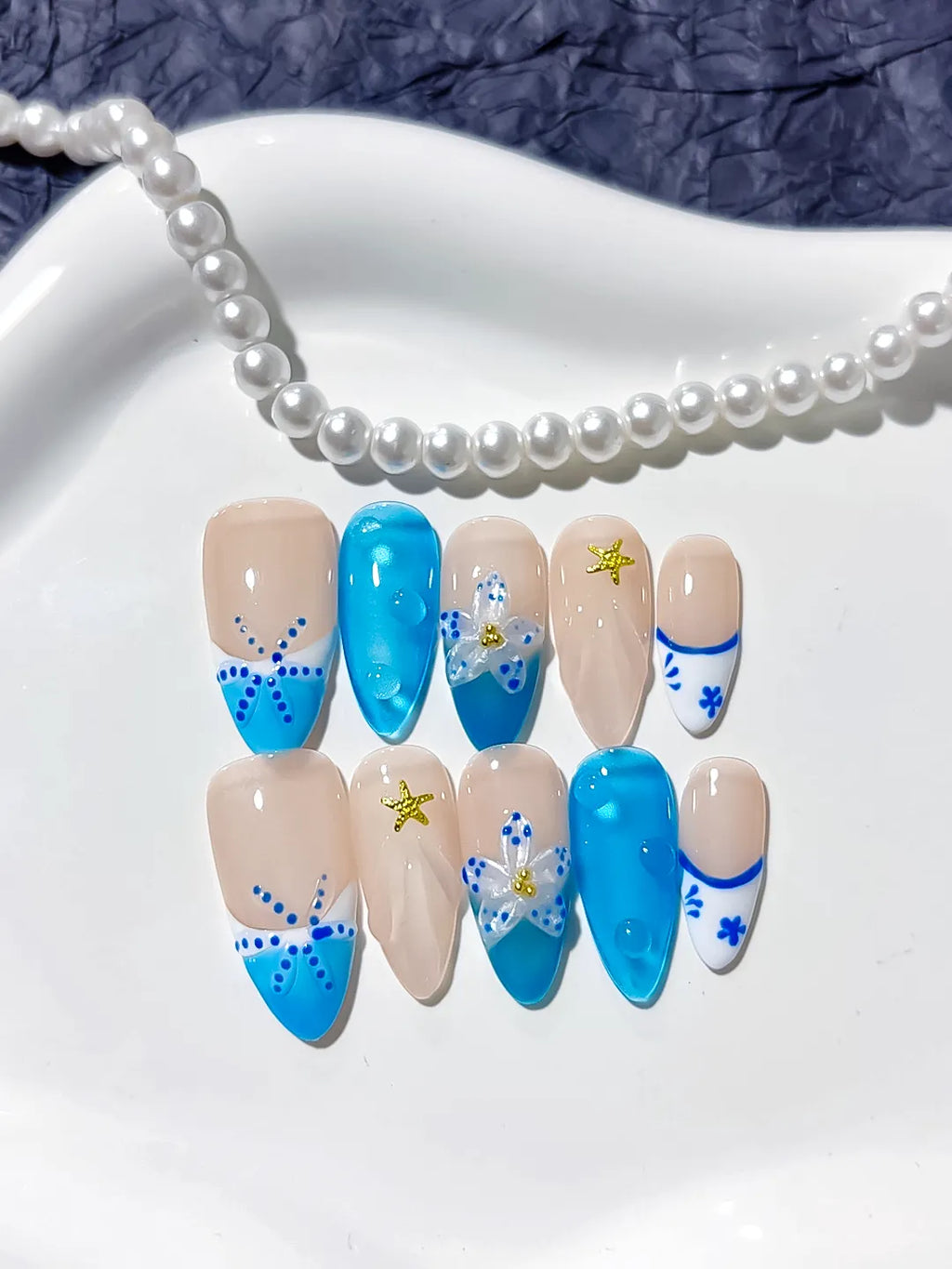 Nude Blue French tip Flower Star press on nails detail view