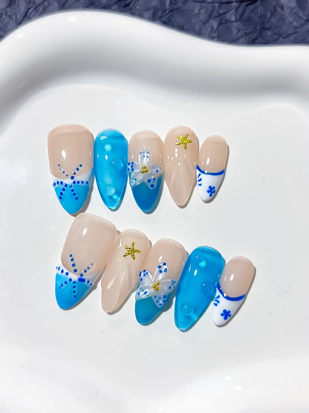 Nude Blue French tip Flower Star press on nails close up