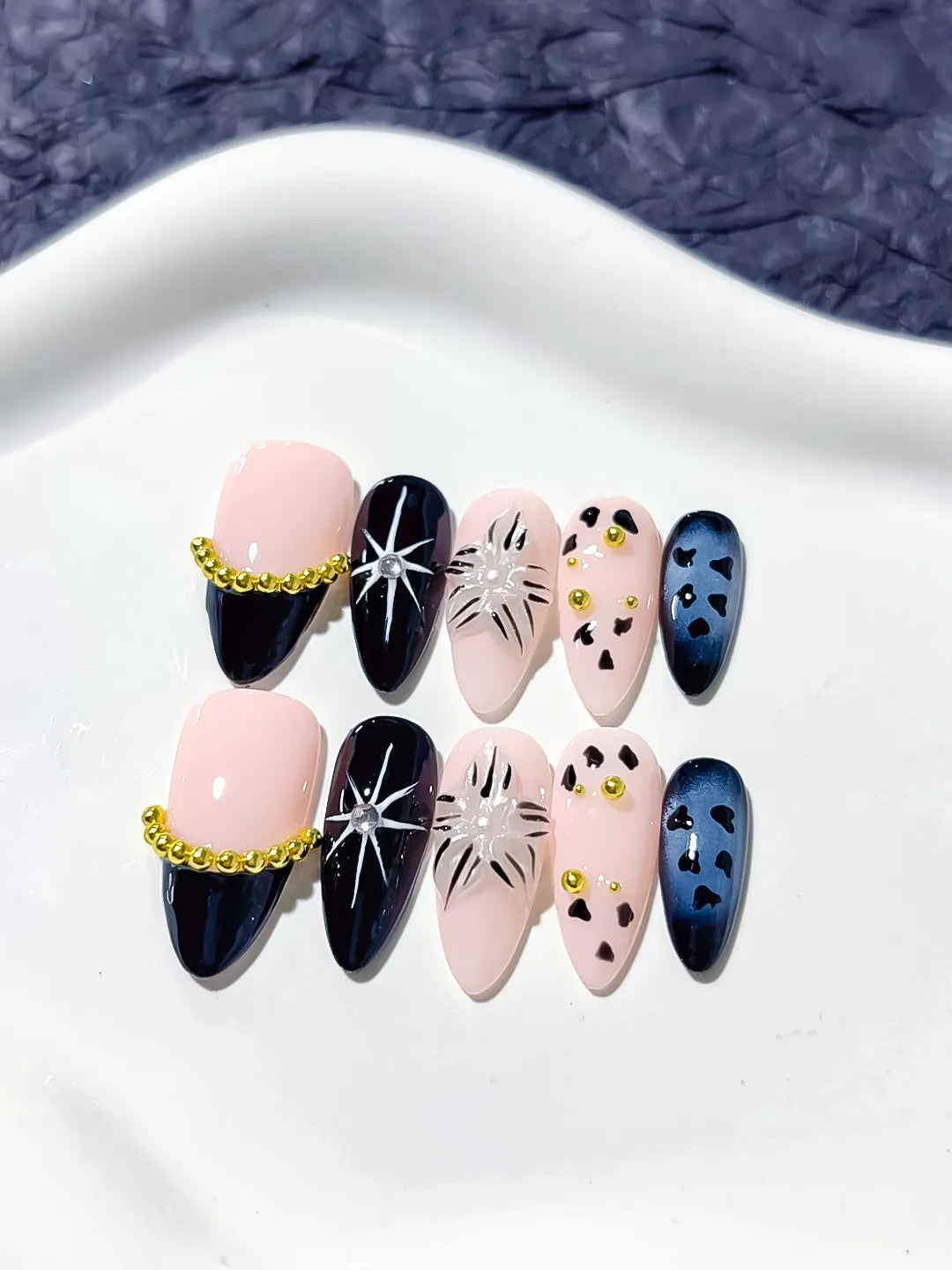 Nude Black Blue Gold French tip Star Animal Print Bead Chain press on nails close up