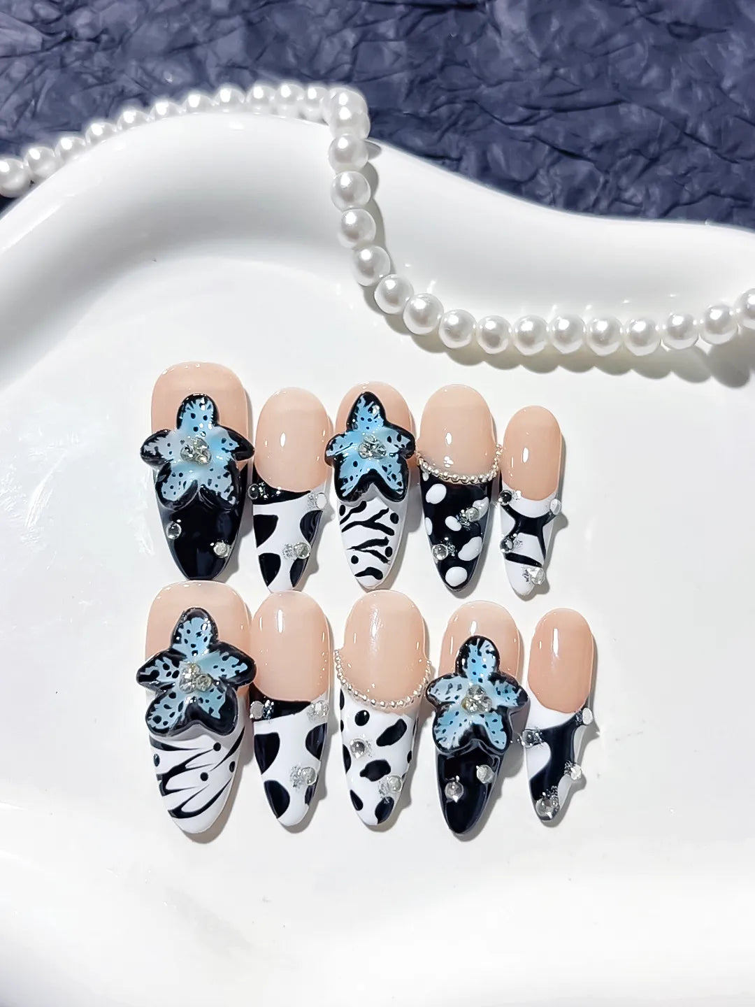 Nude Black White Blue Abstract Flower Pearl press on nails angled view