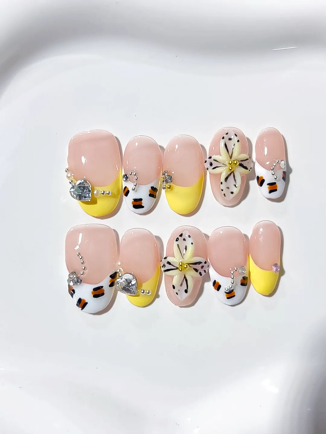 Nude Yellow White French tip Flower Rhinestone press on nails angled view