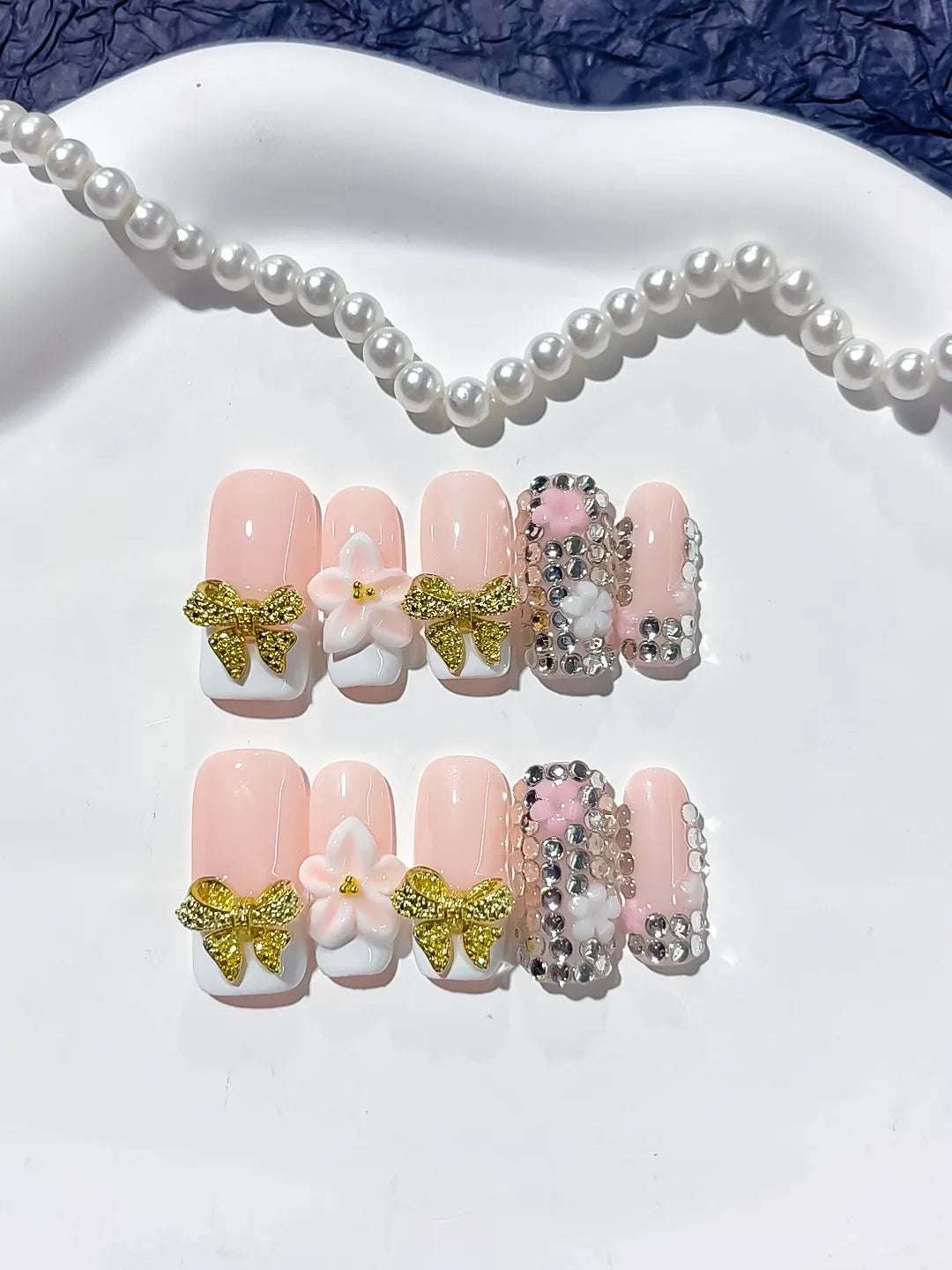Nude Gold White Glitter Bow Flower Rhinestone press on nails detail view