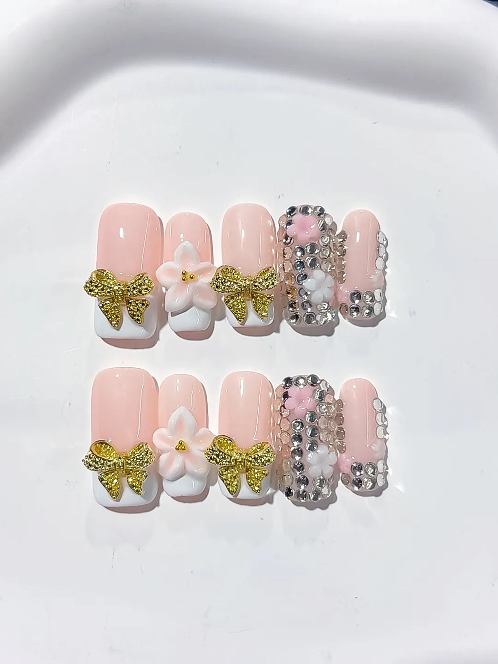 Nude Gold White Glitter Bow Flower Rhinestone press on nails detail view