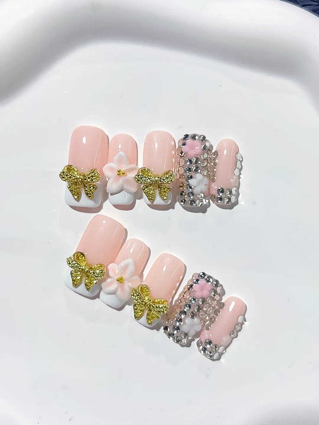 Nude Gold White Glitter Bow Flower Rhinestone press on nails close up