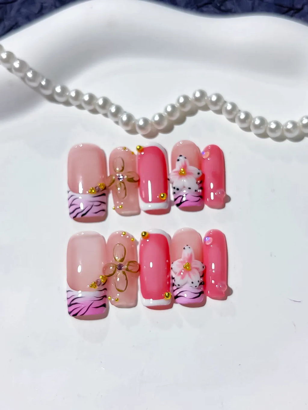 Pink Black Gold Abstract Bow Animal Print Flower press on nails angled view