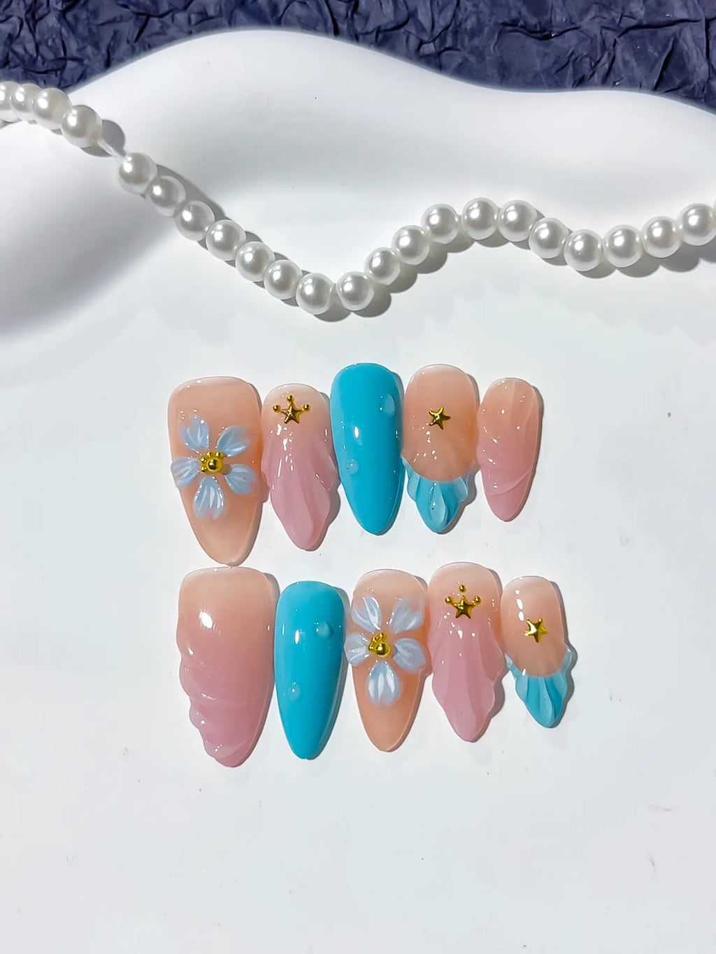 Nude Pink Blue Abstract Flower Star press on nails detail view