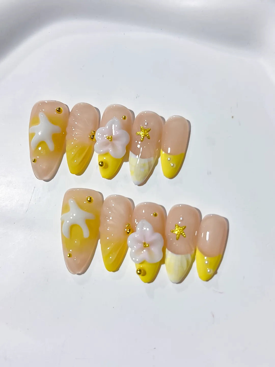 Nude Yellow White French tip Flower Starfish press on nails close up