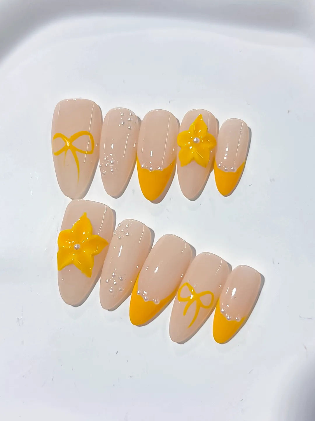 Nude Yellow French tip Flower Bow press on nails detail view
