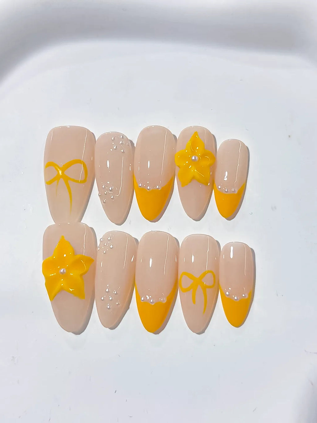 Nude Yellow French tip Flower Bow press on nails detail view