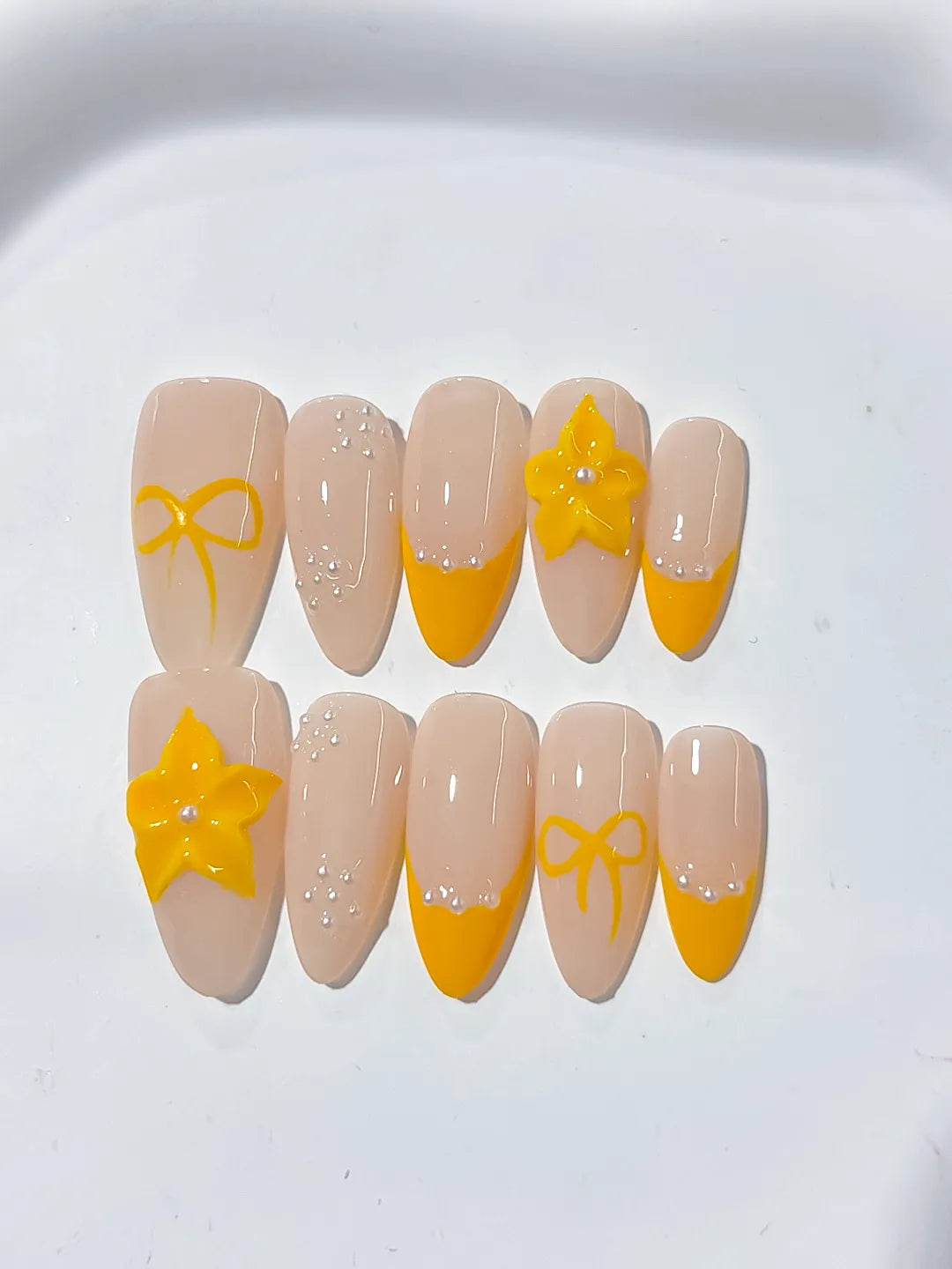 Nude Yellow French tip Flower Bow press on nails detail view