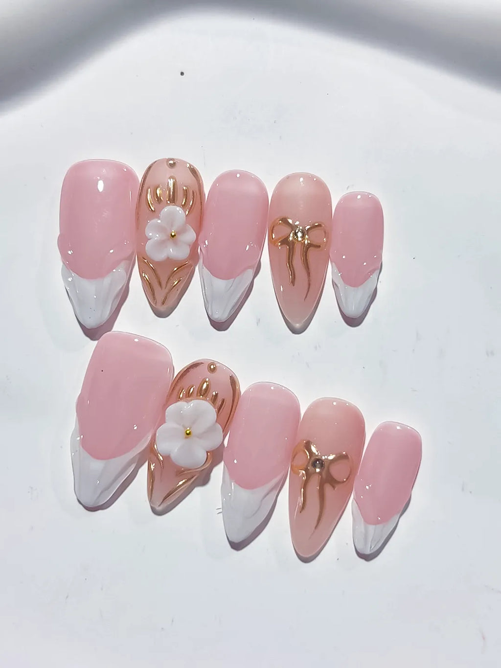 Pink White Gold French tip Flower Bow Metallic Charm press on nails close up