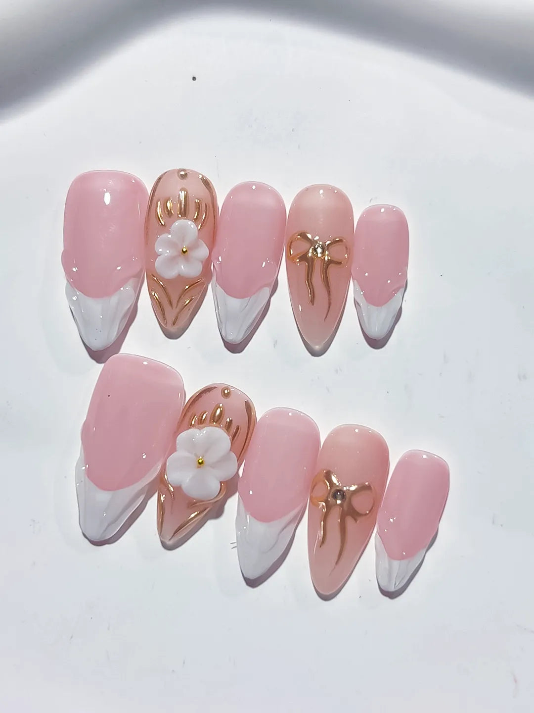 Pink White Gold French tip Flower Bow Metallic Charm press on nails close up