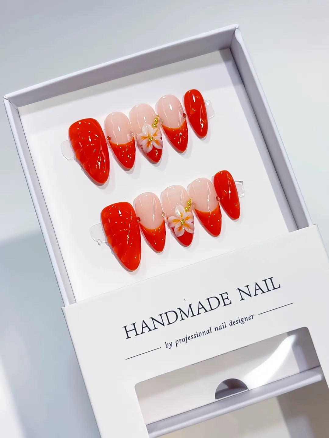 Nude Red Gold French tip Flower Shell press on nails angled view