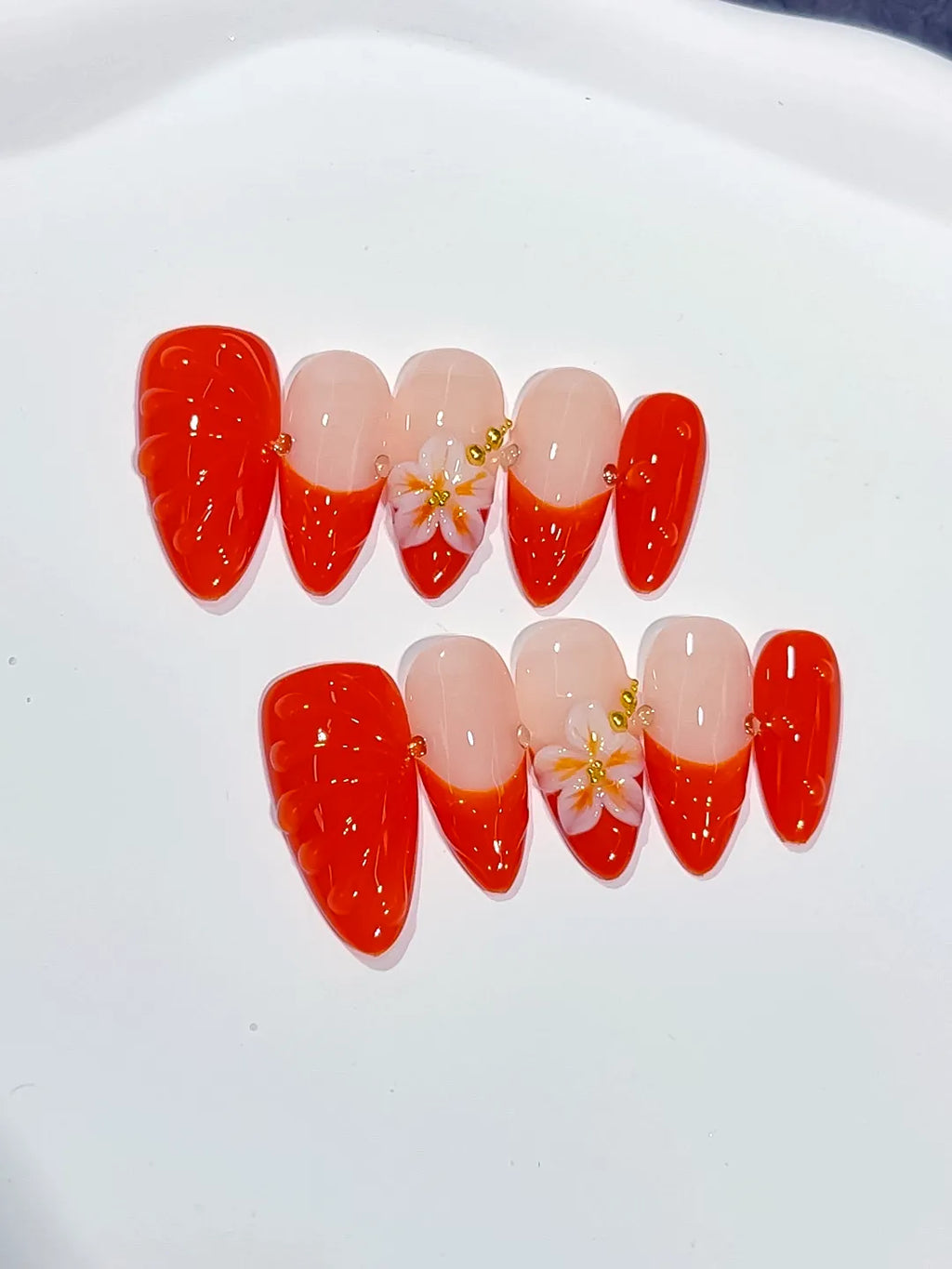 Nude Red Gold French tip Flower Shell press on nails close up