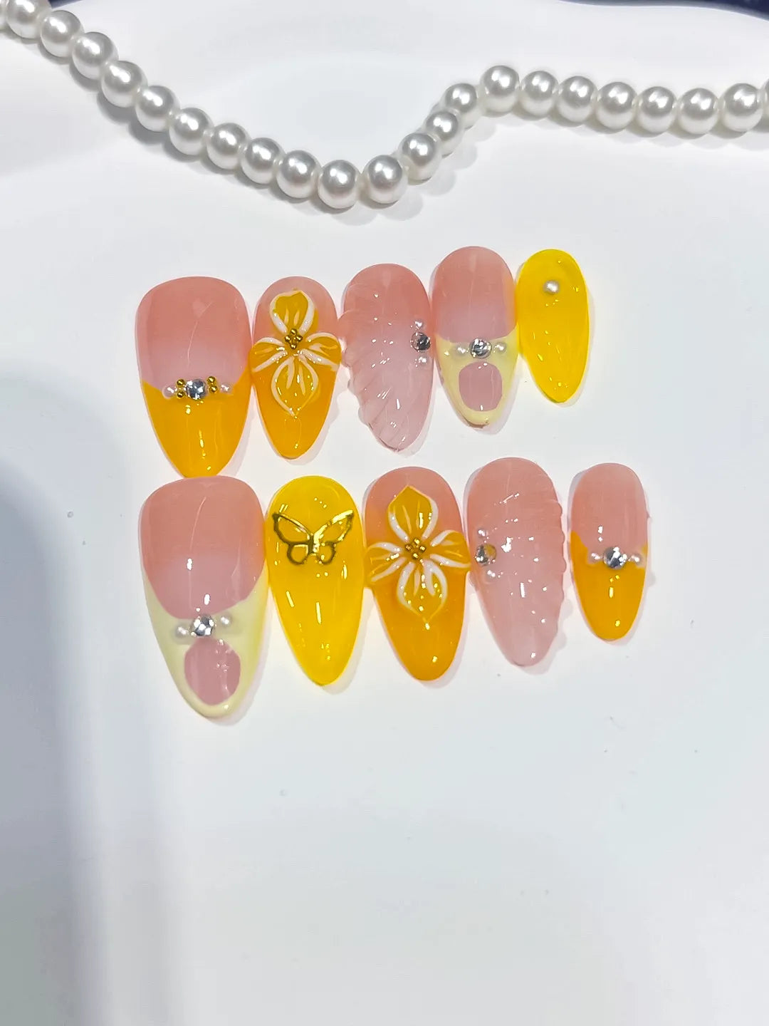 Nude Yellow Pink French tip Flower Rhinestone Heart press on nails angled view