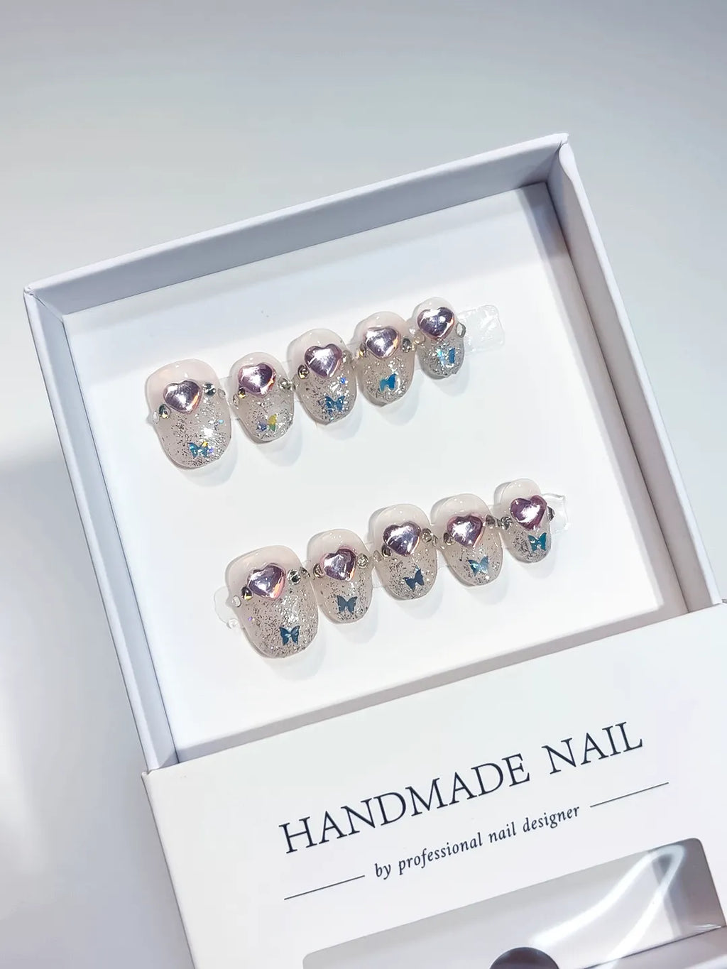 Nude Silver Multicolor Glitter Heart Butterfly Rhinestone press on nails angled view