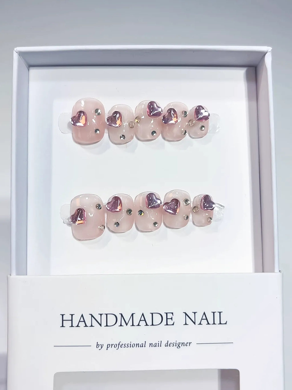 Nude Purple Solid color Heart Rhinestone press on nails angled view