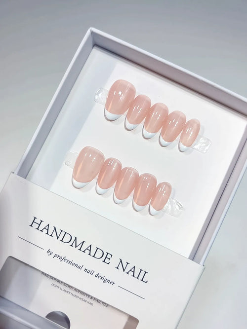 Handmade press on nails short almond nude with mini French tips, centerpiece view