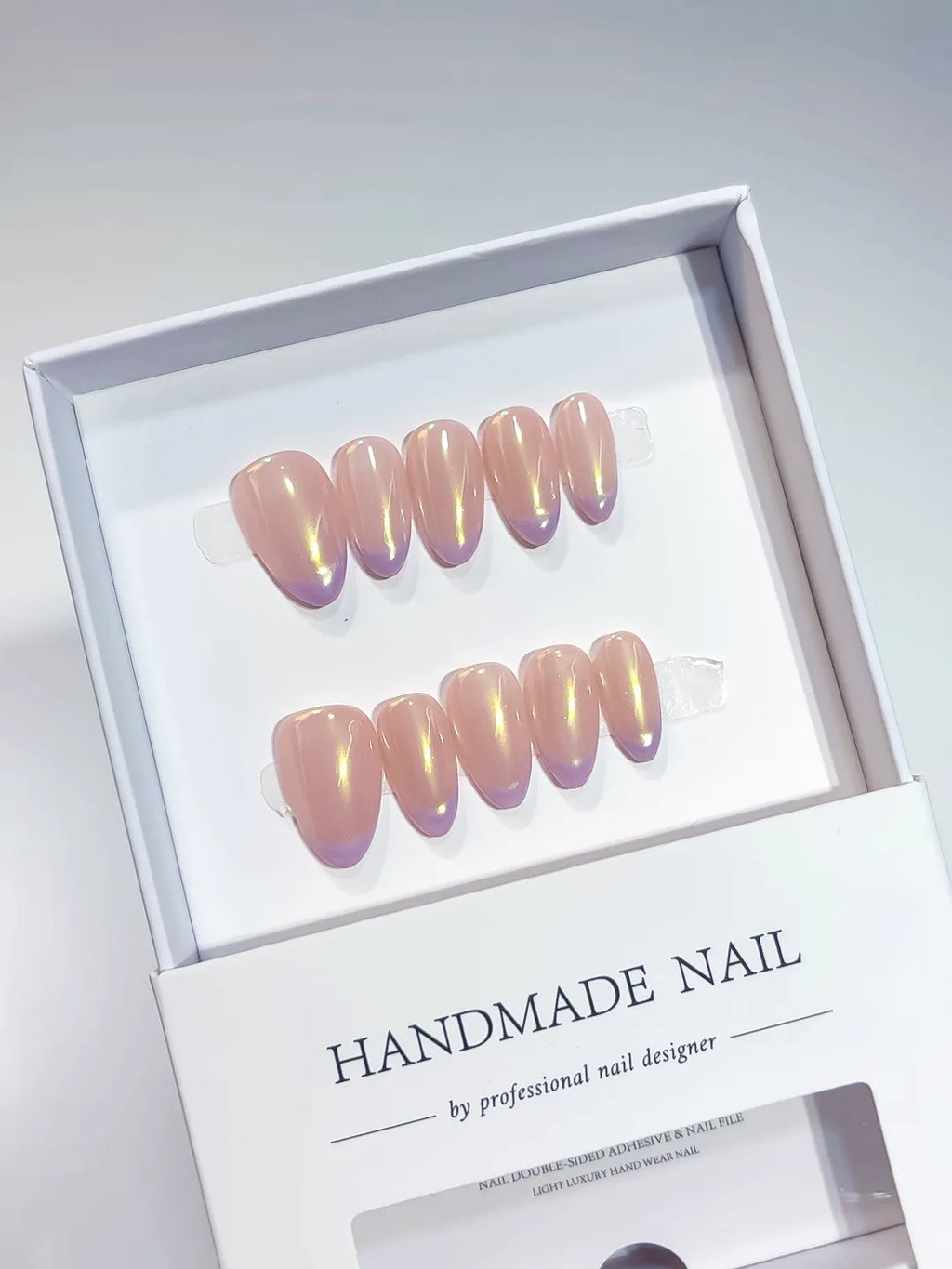 Handmade press on nails short almond nude with aurora shimmer, centerpiece view