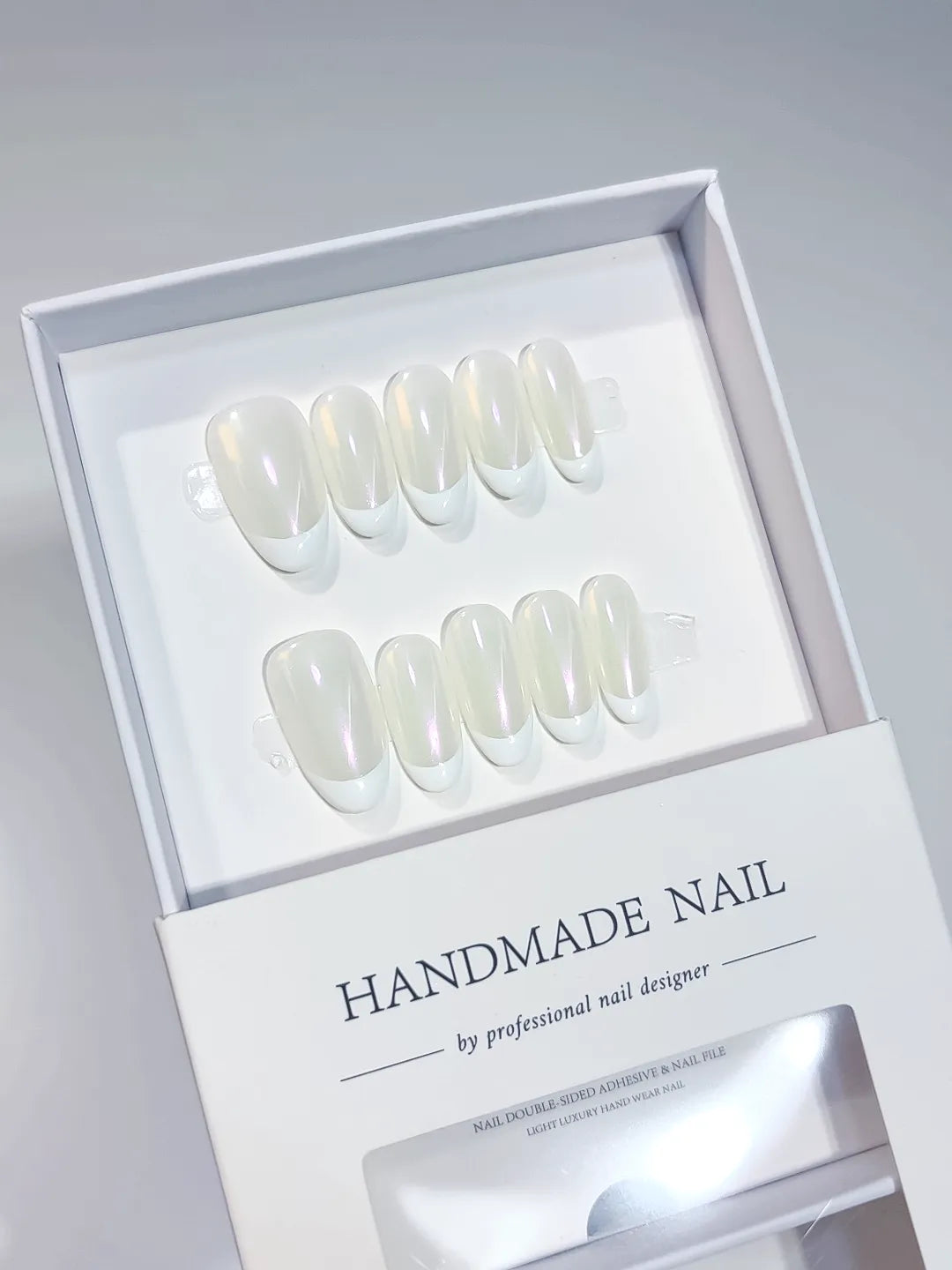 White Solid color Aurora Sheen press on nails angled view