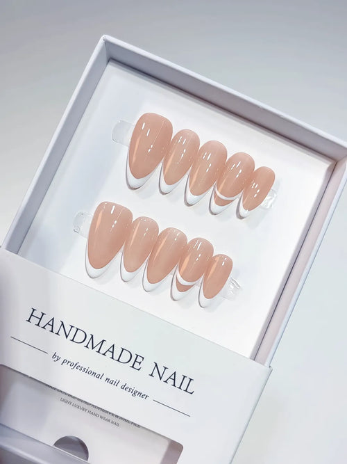 handmade press on nails in nude french design with double line accent, close-up view