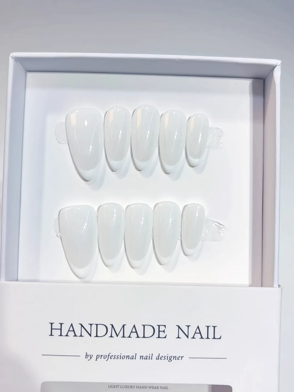 Medium almond white French handmade press on nails, centerpiece view