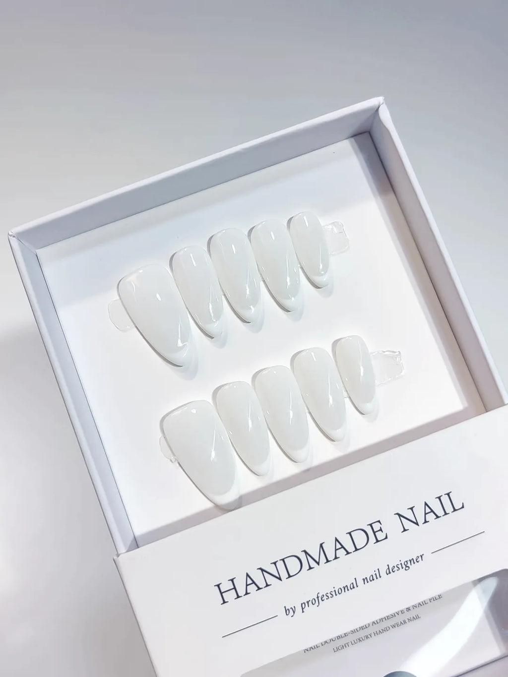 Medium almond white French handmade press on nails, centerpiece view