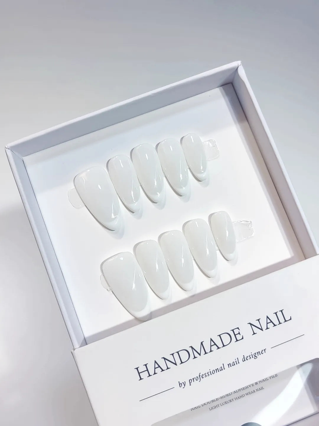 Medium almond white French handmade press on nails, centerpiece view