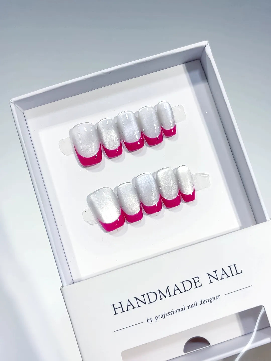 White Pink French tip press on nails angled view